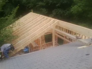 Framing a new roof addition that ties into an existing shingle roof in Banks